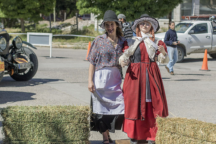 Tea house lady poses with mascot mannequin brought from Wales